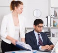 Office worker shocked by stack of papers Royalty Free Stock Photo