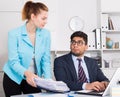 Office worker shocked by stack of papers Royalty Free Stock Photo