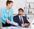 Office worker shocked by stack of papers Royalty Free Stock Photo