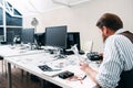 Office worker sitting late at work with drone