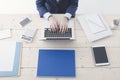 Office worker typing on a laptop