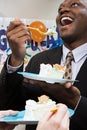 Office workers eating party cake Royalty Free Stock Photo