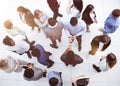 office workers and foreign employees stand and talk in the office lobby.Top view.