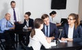 Office workers with laptops having a productive day at work Royalty Free Stock Photo