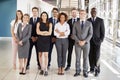 Office workers in a modern lobby, full length group portrait Royalty Free Stock Photo