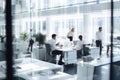 office workers in modern offices talking and sitting on computer