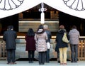 Office workers pay their respects at Yasukuni Shrine, Tokyo, Japan