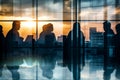 office workers seen as silhouettes against a reflective glass Royalty Free Stock Photo