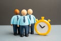 Office workers and the stopwatch. Temporary employees. Working hours and overtime Royalty Free Stock Photo