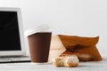 Office workplace with breakfast. Donuts and coffee Royalty Free Stock Photo