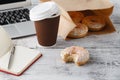 Office workplace with breakfast. Donuts and coffee Royalty Free Stock Photo
