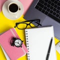 Office workplace desk with computer, accessories, coffee and alarm clock. The concept of morning or deadline. Royalty Free Stock Photo