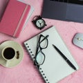 Office workplace desk with computer, accessories, coffee and alarm clock. The concept of morning or deadline. Royalty Free Stock Photo