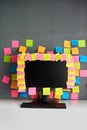 Office workplace with desktop pc full of blank colorful sticky notes Royalty Free Stock Photo