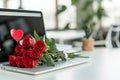 in office, at workplace, heart is painted on monitor screen, and on keyboard there is a bouquet of red roses, the concept of