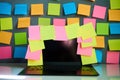 Office workplace with laptop and blank colorful sticky notes reminders Royalty Free Stock Photo