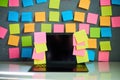 Office workplace with laptop and blank colorful sticky notes reminders Royalty Free Stock Photo