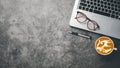 Office workplace with laptop computer, eyeglass, pen and cup of coffee, Top view Royalty Free Stock Photo