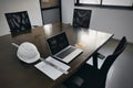 Office workplace with laptop desktop notes paper on a wooden business meeting conference table chair Royalty Free Stock Photo