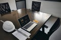 Office workplace with laptop desktop notes paper on a wooden business meeting conference table chair Royalty Free Stock Photo