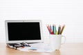 Office workplace with laptop, reports and pencils Royalty Free Stock Photo