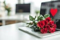 in office, at workplace, sweet heart is painted on monitor screen, and on keyboard there is bouquet of red roses, concept of