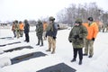 An officer instructing recruits on shooting range before training