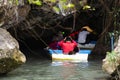 Officer local guide bring thai people and foreign travelers sit on boat through the cave travel visit in tham nam yen at Khao