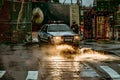 An Officer and a Police Vehicle with its Headlights Shed Light on Steam Coming from the Sewers in Lower Manhattan, New York City