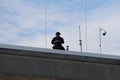 Officer with binoculars looking at crowd