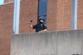 Officer with cell phone recording BLM crowd