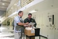 Officers in conversation in a prison cell area at a correctional facility in Stockton, United States Royalty Free Stock Photo