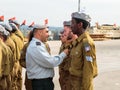 Officers of the IDF reward the soldier with the insignia at the formation in Engineering Corps Fallen Memorial Monument in Mishmar