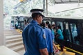 Officers protect tourists at monorail station from Penang HIll at George Town. Penang, Malaysia