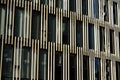 Offices building exterior in summer sunny day. Blue sky had been reflected in the glass of windows. Royalty Free Stock Photo