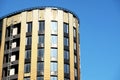 Offices building exterior in summer sunny day. Blue sky had been reflected in the glass of windows. Royalty Free Stock Photo