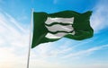 official city flag of Hiroshima, Hiroshima waving in the wind on flagpoles against sky with clouds on sunny day. Japan Patriotic Royalty Free Stock Photo