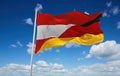 official flag of Austria and Germany Austria at cloudy sky background on sunset, panoramic view. Austrian travel and patriot