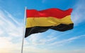 official flag of Belgium 1830 , Belgium at cloudy sky background on sunset, panoramic view. Belgian travel and patriot concept.