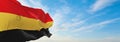 official flag of Belgium 1830 , Belgium at cloudy sky background on sunset, panoramic view. Belgian travel and patriot concept.