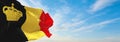 official flag of Belgium yacht ensign , Belgium at cloudy sky background on sunset, panoramic view. Belgian travel and patriot