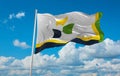 official flag of Edmundston Canada at cloudy sky background on sunset, panoramic view. Canadian travel and patriot concept. copy