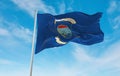 official flag of Pangkalpinang City Indonesia at cloudy sky background on sunset, panoramic view. Indonesian travel and patriot