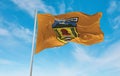 official flag of Puncak Jaya Regency Indonesia at cloudy sky background on sunset, panoramic view. Indonesian travel and patriot