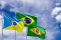 Official flags of the country Brazil, state of Ceara and city of Juazeiro do Norte. Swaying in the wind under the blue sky. 3d