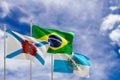 Official flags of the country Brazil, state of Rio Janeiro and city of Rio de Janeiro. Swaying in the wind under the blue sky. 3d