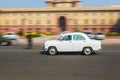 Official Hindustan Ambassador car driving outside North Block, S Royalty Free Stock Photo