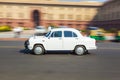 Official Hindustan Ambassador car driving outside North Block, S Royalty Free Stock Photo