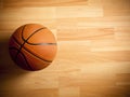 An official orange ball on a basketball court Royalty Free Stock Photo