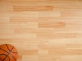An official orange ball on a basketball court Royalty Free Stock Photo